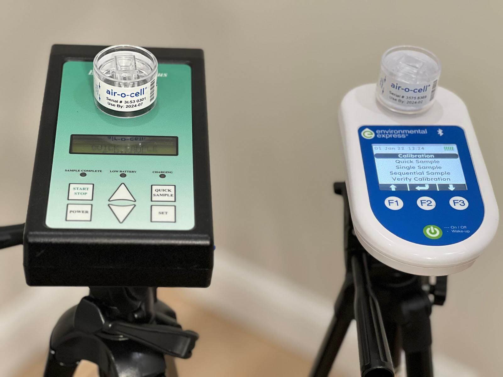 Two air sampling pumps with cassettes mounted on tripods