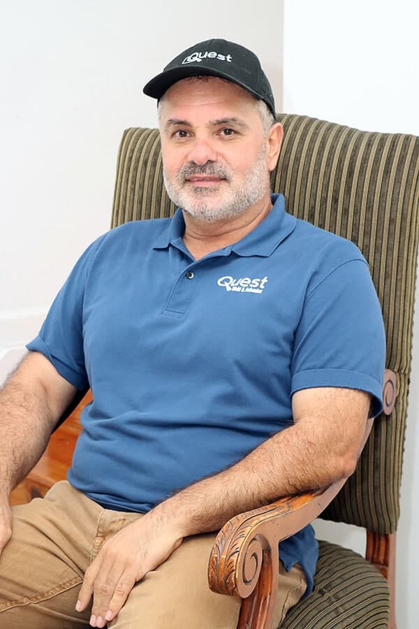 Quest team member in a Quest-branded polo shirt